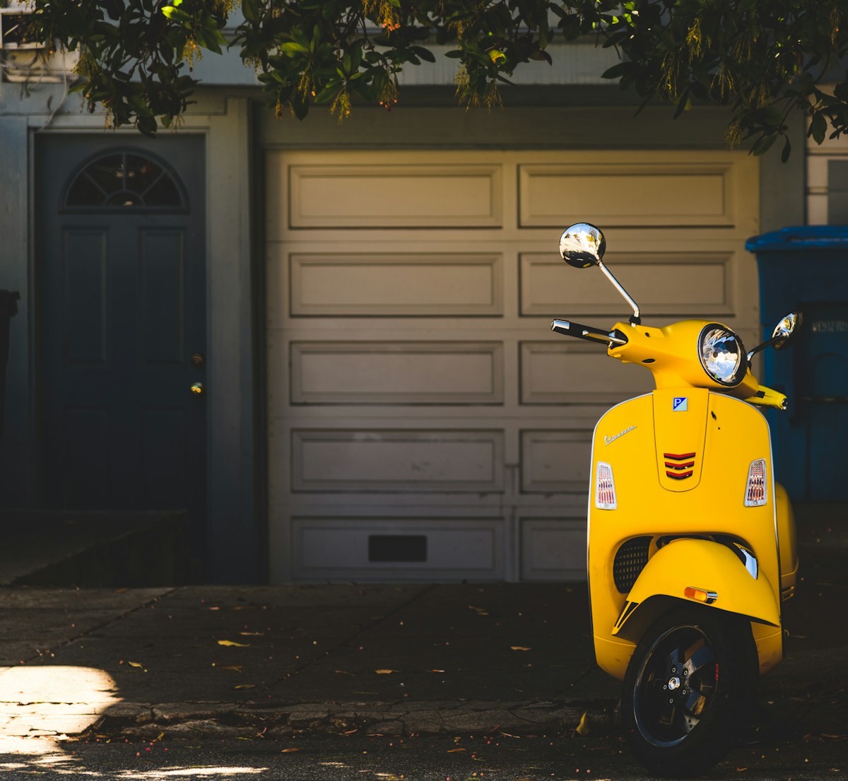 A yellow motor scooter outdoors
